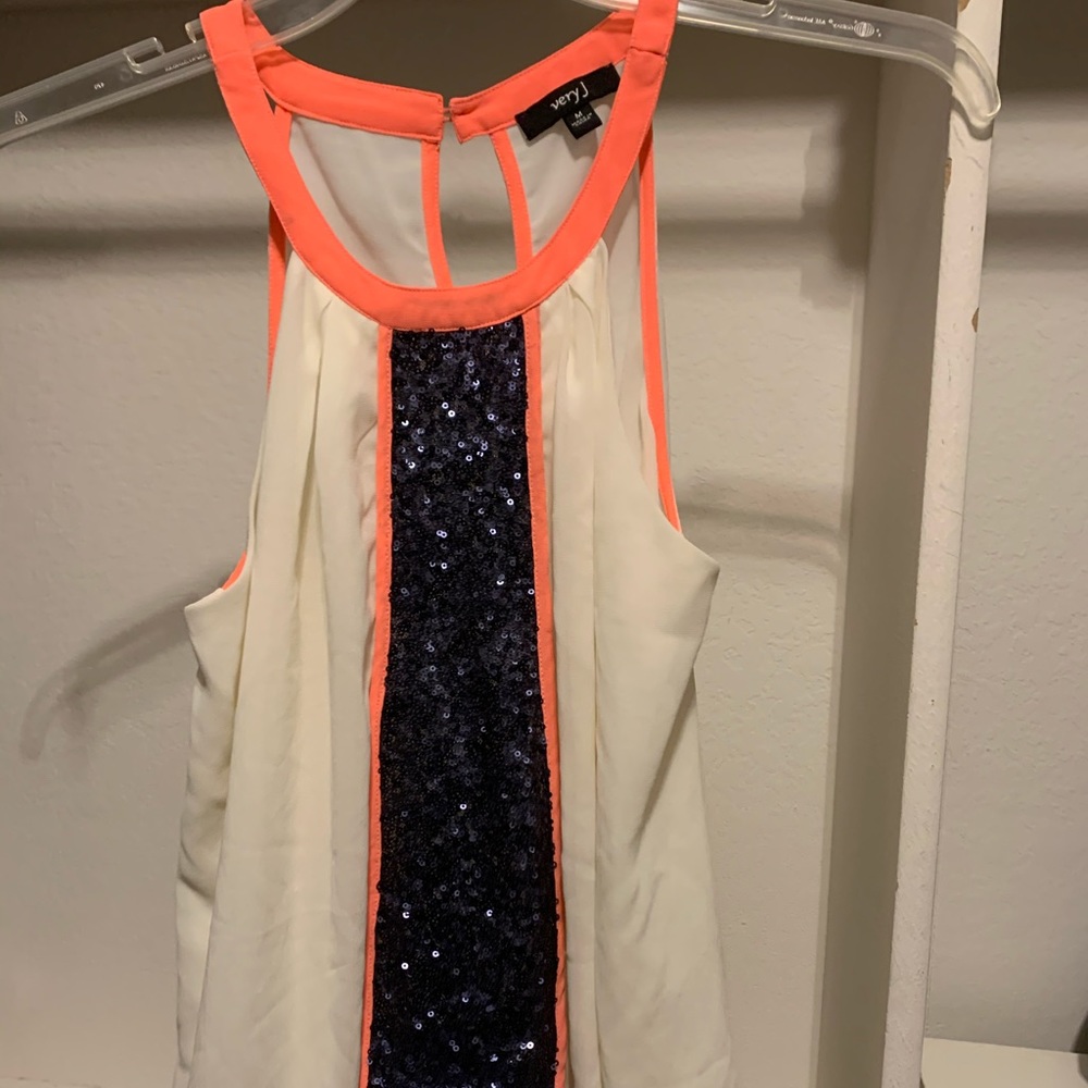 Sleeveless halter top with black sequence.
